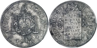 a silver coin with a coat of arms on it
