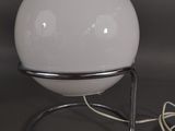 an image of a white ball lamp on a stand