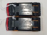 two batteries attached to each other on a white surface