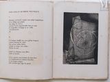 an open book with a picture of a clock inside of it