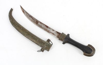 pair of old and rusty knifes on a white surface