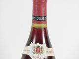 a bottle of wine that is sitting on a table
