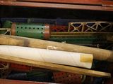 a wooden box filled with different types of baseball bats