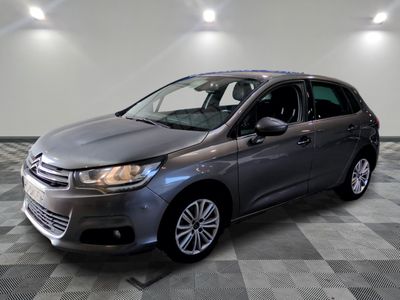 the grey citrole is parked on a checkered tile floor