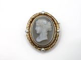 a close up of a ring with a picture of a woman