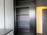 an image of a kitchen with a pantry in the corner