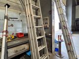 two ladders that are leaning up against the wall