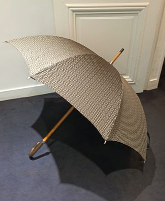 a umbrella that is sitting on the floor in the room