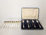 six spoons in a case on the table