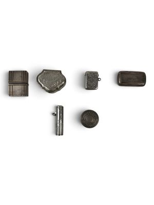 an image of a group of metal objects on a white surface