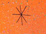a close up of an orange plate with a star on it