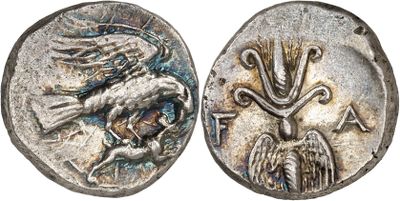 a silver coin with an image of a bird on it