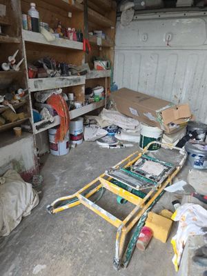 an image of a garage with a ladder in the middle of it