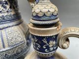 a close up of a blue and white vase and a blue and white tea pot