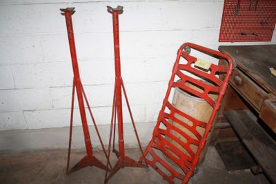 a pile of tools sitting next to a pile of wood
