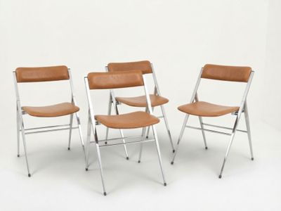 three chairs with a leather seat and back rest on a white surface