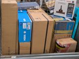 many boxes in the back of a truck that is full of stuff