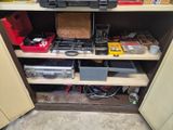 many tools on the shelves in the garage