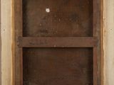 an old picture of a wooden frame with a hole in it