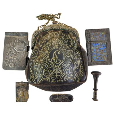 a purse that is sitting on a table next to other items