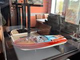a display case with a model of a boat in it