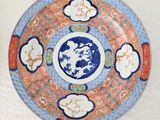 a plate with a blue and orange design on it