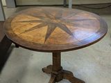 a wooden table with a star design on it