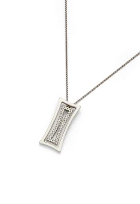 a close up of a necklace on a white surface with a chain