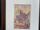aquarelle encadrée représentant un château sur une colline, dans un cadre en bois