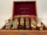 a wooden box with many bottles of medicine in it