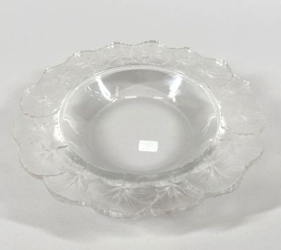 a clear glass bowl on a white surface