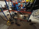 a picture of a garage with a lot of tools on the floor