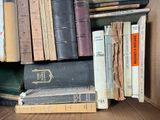 many books that are stacked on top of each other