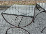 two tables that have glass tops on them