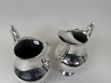 pair of silver plated sugar and pepper shakers with black onyx