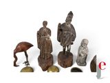 a lot of statues that are sitting on a white surface
