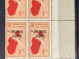 four stamps with a map of france on them sitting on a table