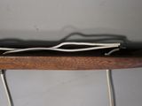 a wooden shelf with wires on top of it