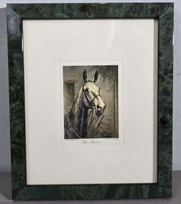 painting of a white horse in a green frame on a table