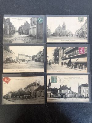 four postcards of old photos of a street in a town