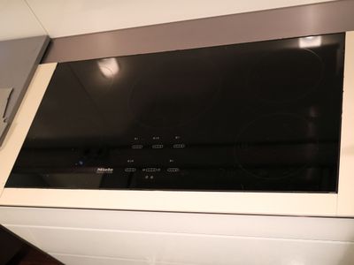 a microwave with a glass top in a kitchen