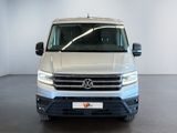 the front view of a white vw transport van parked in a white room