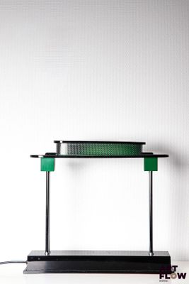 an image of a desk with a lamp on top of it