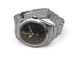 a silver watch with a black face and gold hands