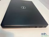 a close up of a dell laptop on a white table