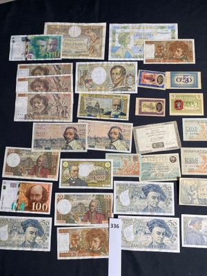 many different types of paper money on a table
