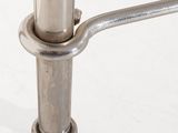 a close up of a metal pole on a white surface