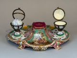 a table with a mirror and a candle holder on it