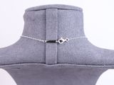 a close up of a silver necklace on a mannequin head