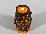 a candle that is sitting on a white table